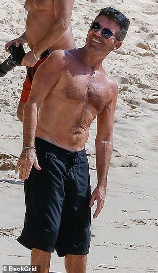 simon cowell 60 displays his slim physique as he joins