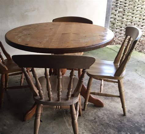 good home  pine kitchen table   mismatched chairs