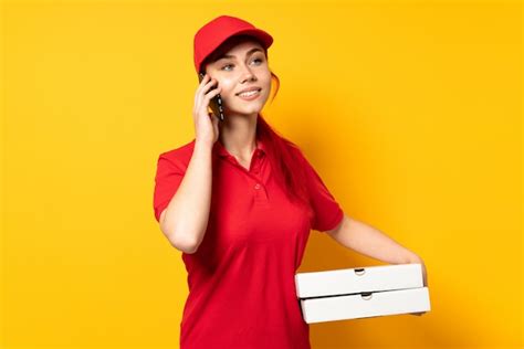 premium photo pizza delivery girl holding a pizza over isolated wall