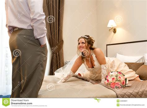Bride Waiting For Her Sweetheart On Bed Stock Image