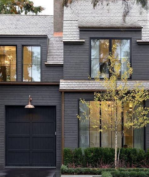 dark grey exterior black windows copper gutters  light fixtures