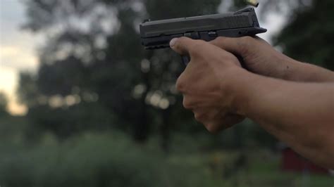 4k 60 Fps Slow Mo Man Fires 44 Mm Hand Gun Shooting Tight Shot Target
