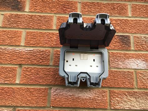 lockable double outdoor socket install   brick building ideal