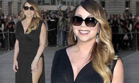 mariah carey in a sheer dress featuring a sexy thigh high split in paris daily mail online