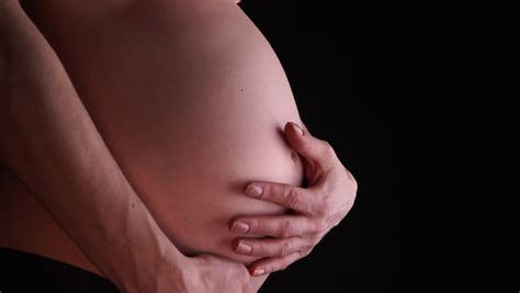 nude pregnant women stroking belly stock footage video 4911557 shutterstock