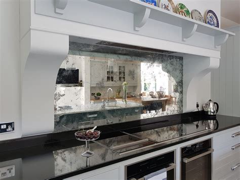 antique mirrored splashback surrounded  bespoke centre piece canopy   classic hand