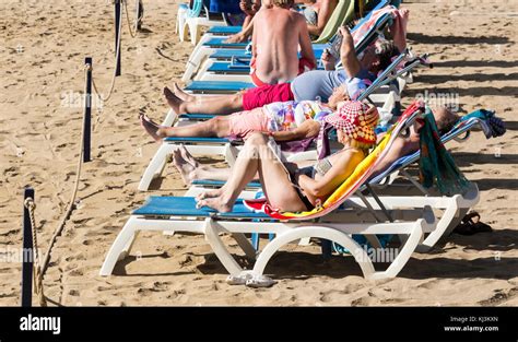 woman sunbathing beach spain  res stock photography  images alamy