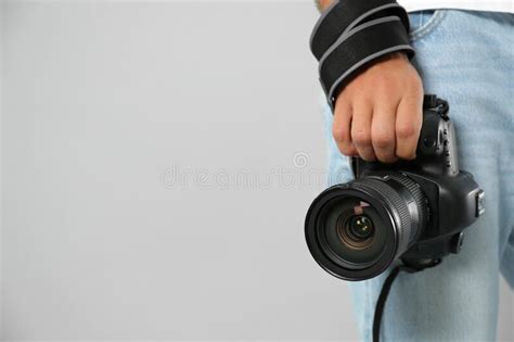 man photographer  modern photo camera    outdoors stock photo image