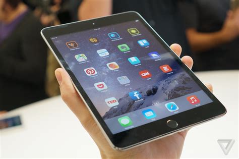 ipad mini  hands   apples latest  tablet  verge