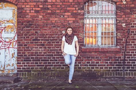 Girl Leaning Against Blue Wall High Quality People Images ~ Creative