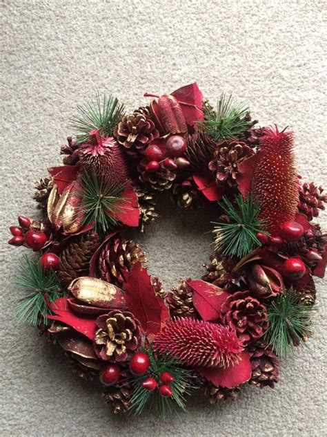 christmas wreath  pine cones  red berries