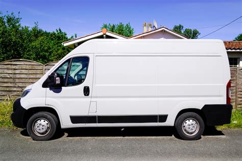 premium photo white delivery truck rendering van side view  street