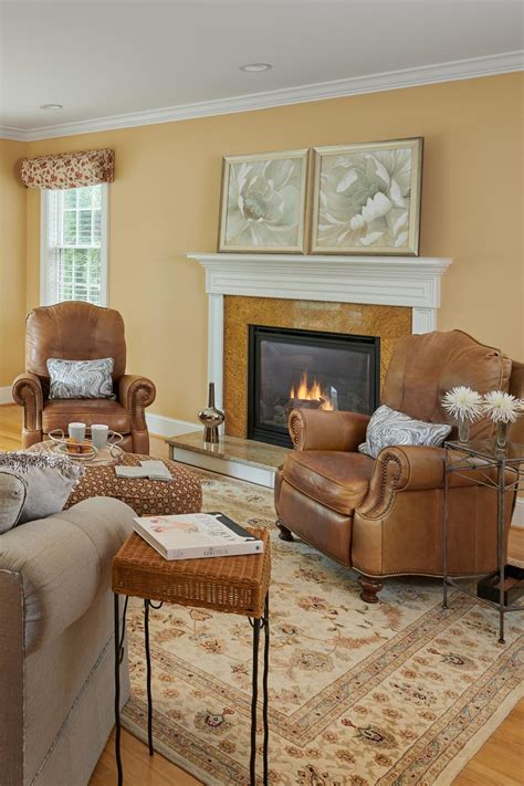 family room  neutral color palette  traditional fireplace hgtv