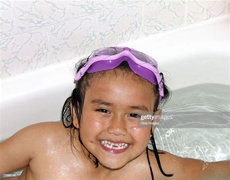 girl taking a bath photo getty images