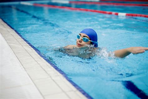 person  swimming goggles  swimming pool  stock photo