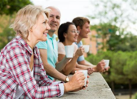 Couples Walking And Drinking Coffee Stock Image Image Of Senior