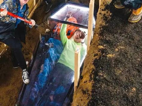 man buried alive  coffin   hours youtuber mrbeast spends