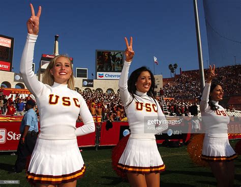 usc song girl cheerleaders flash the fight on sign during 26 20 news photo getty images