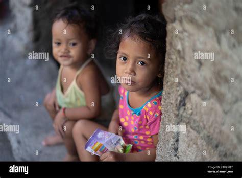 Two Young Girls Within A Poor Slum Area Of Cebu City Philippines Stock