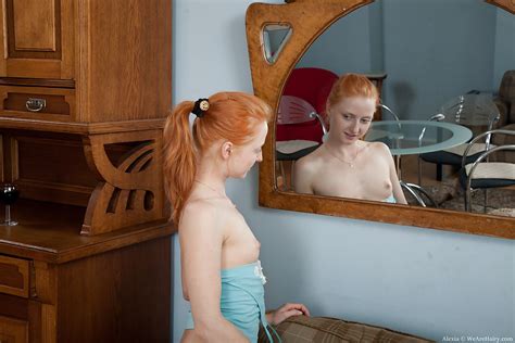 skinny redhead babe in blue stockings alexia taking off her clothes