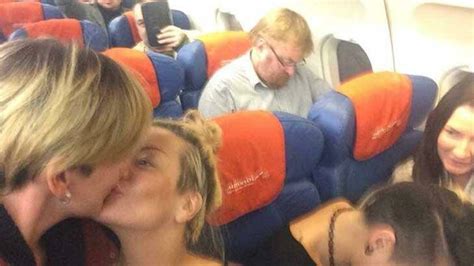 Russian Lesbians Seize In Flight Moment To Kiss In Front Of Homophobic
