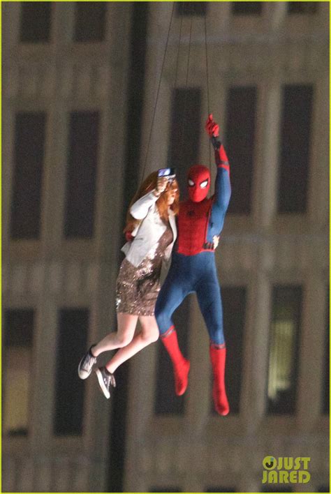 spider man stunt doubles hang from a helicopter photo