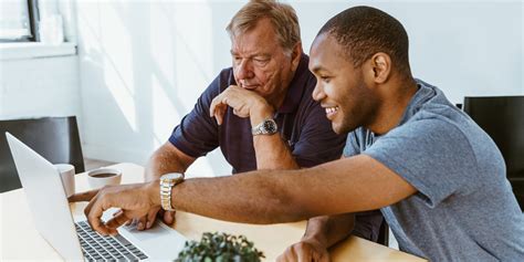 man helping  senior citizen   computer digital leaders