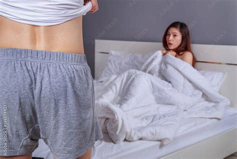 Couple In Bedroom Is Having Sex Man Taking His Clothes Off With Woman