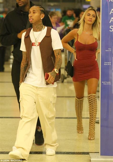 tyga is spotted with a busty mystery blonde at lax daily mail online