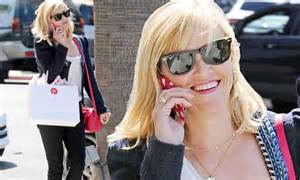 reese witherspoon opts for casual chic ensemble as she