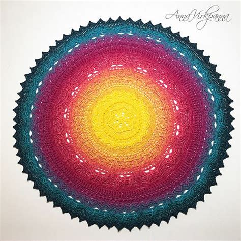 colorful crocheted doily  shown   shape   sunburst