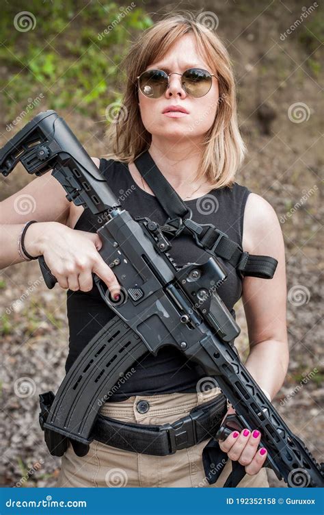 attractive female soldier hold rifle machine gun woman  weapon
