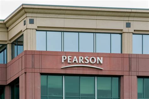 pearson reports slump  sales  school closures  investment