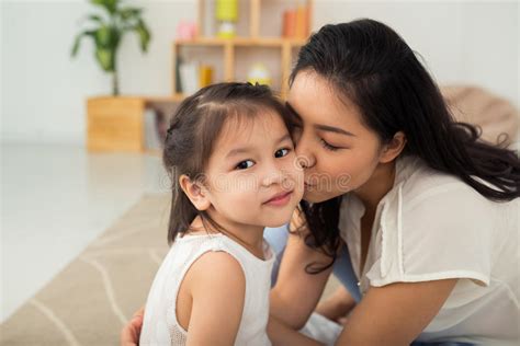 little daughter kissing her mother stock image image of