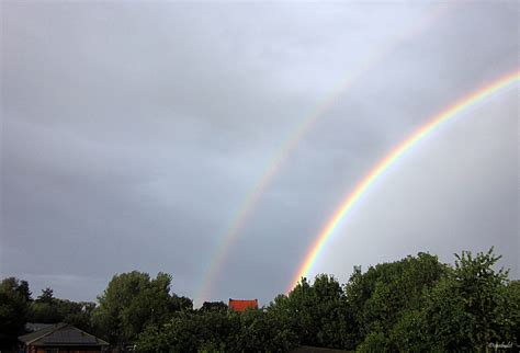 marleen lefevre de beloofde foto van de dubbele regenboog op  augustus boven hoegaarden en