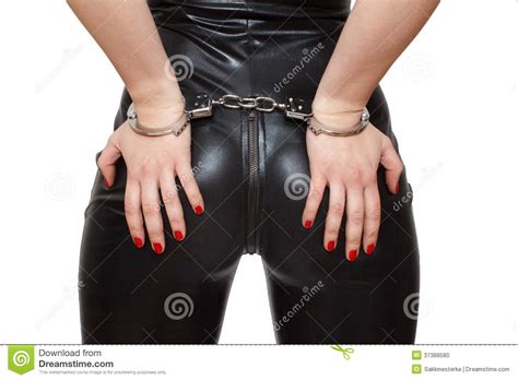 dominatrix hands on in handcuffs closeup isolated stock