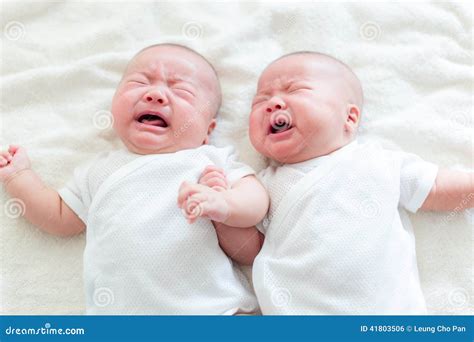 baby twins cry stock photo image