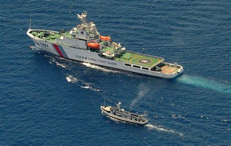 china warns philippine ships making trouble  island dispute escalates