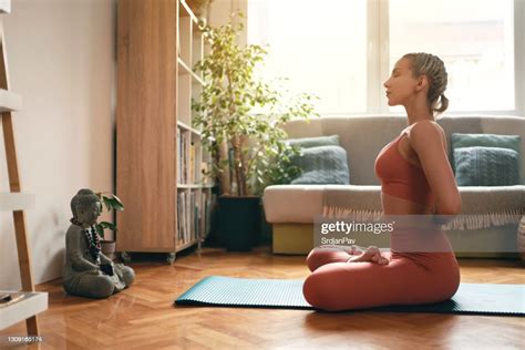 side view   young woman practicing yoga   reverse prayer