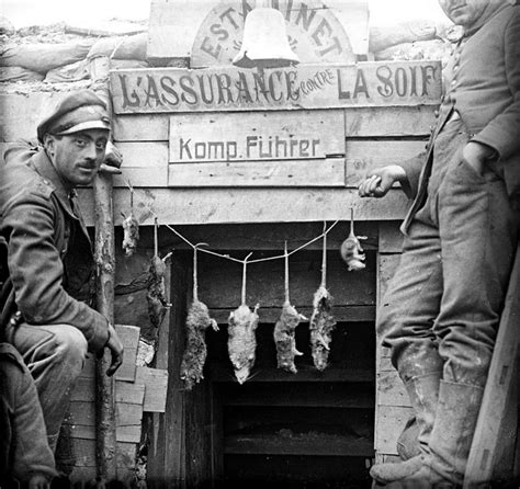 Two German Soldiers Posing With Rats Caught In Their
