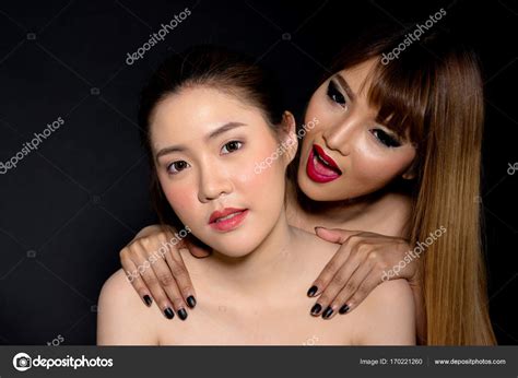 Asian Lesbian Couple Isolated On Black Background With Copy Spac
