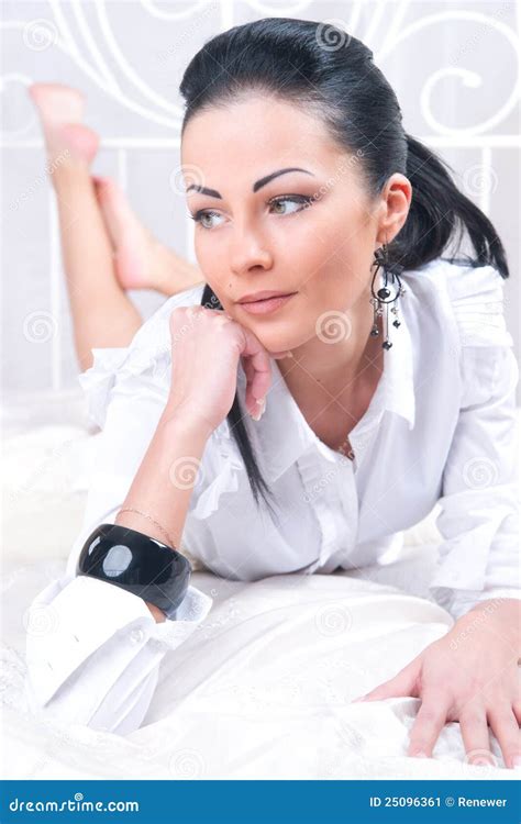 Portrait Of Brunette Woman On The Bed Stock Image Image Of Carefree