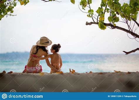 Mother And Daughter In Bikini Sit On Beach Stock Image Image Of
