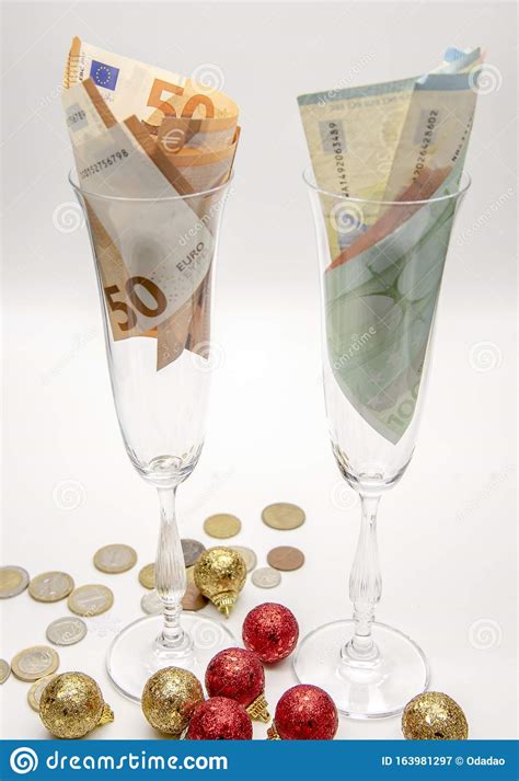 two glasses with euros on a light background stock image image of