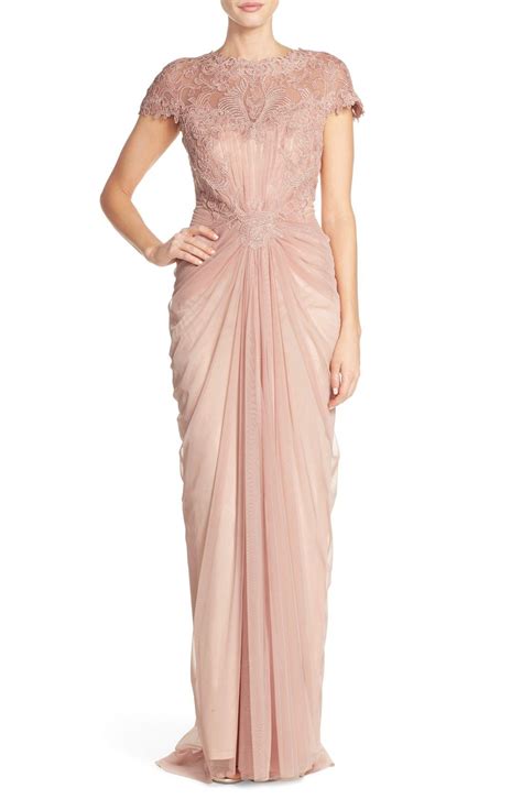 beautiful lace like embroidery spans across this classic gown with a