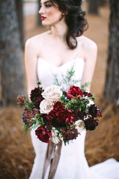 picture of red burgundy and a dark purple wedding bouquet