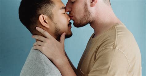man kissing  man   nose  stock photo