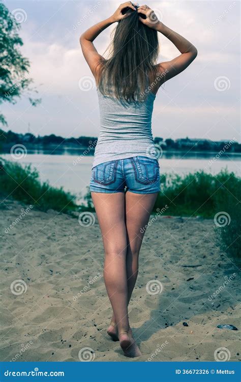 slim woman standing  view stock photo cartoondealercom