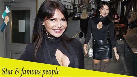 lizzie cundy flaunts her curves in a racy black top and