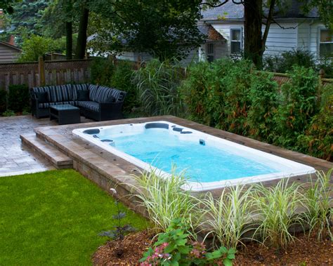 hydropool  cleaning swim spa installed  ground  stone deck